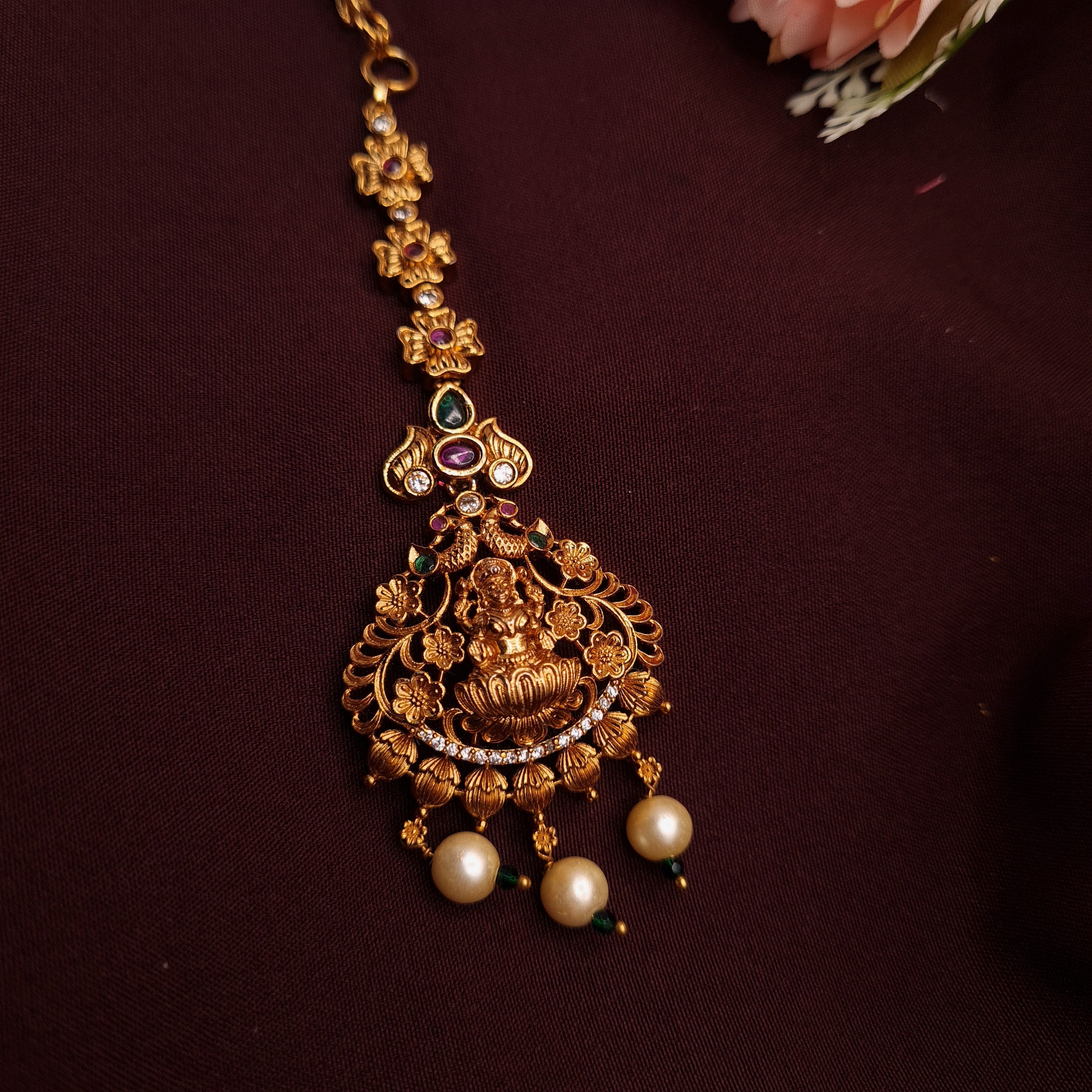 Divine Lakshmi Maang Tikka in antique copper with pearl drops