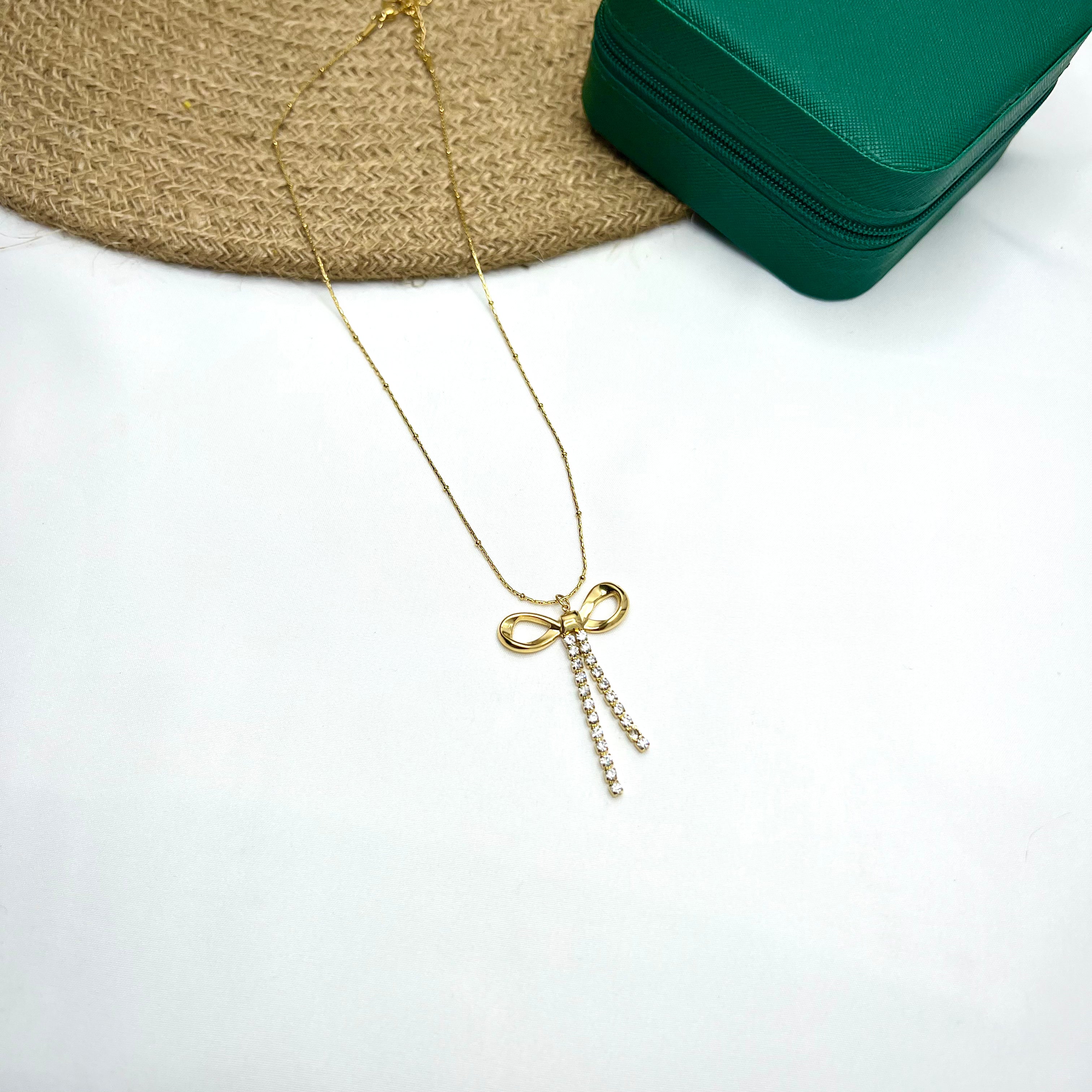 Celestial Bow Necklace – Diamond-Studded Grace