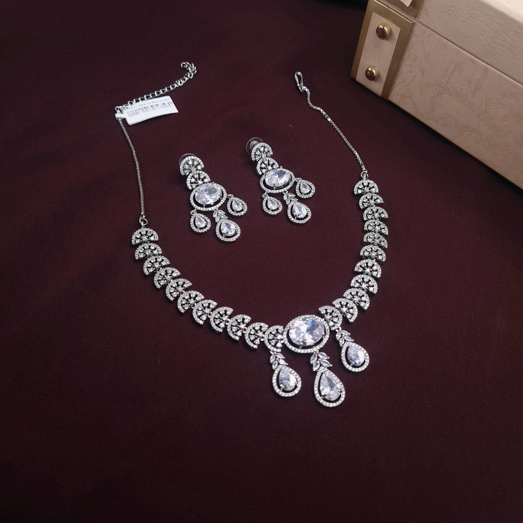 Silver zirconia necklace set with tear-drop and oval-cut stones and matching dangle earrings

