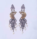 Dual-tone oxidised peacock earrings with pearl drops and lavender stones

