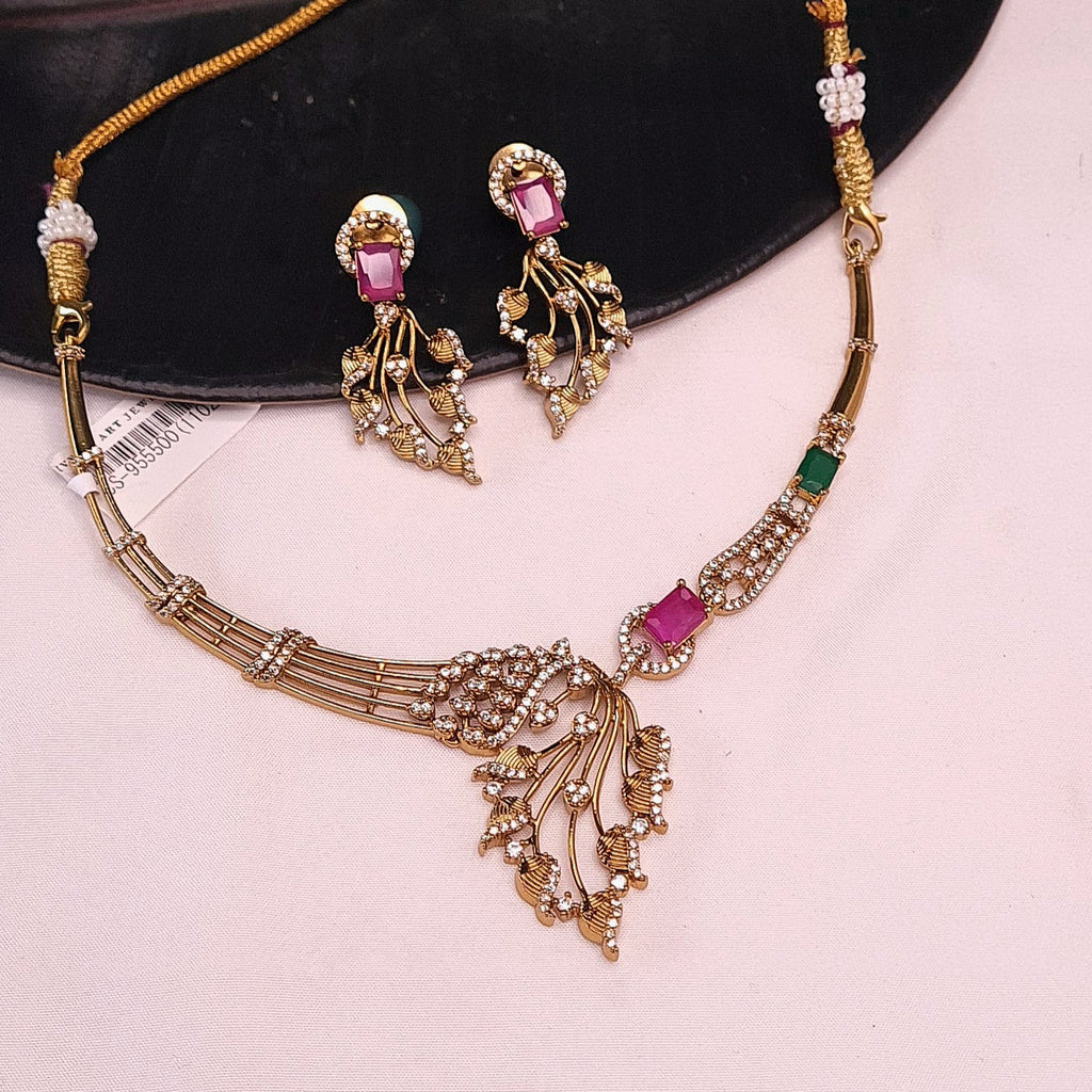 CZ statement necklace with leaf design and matching earrings

