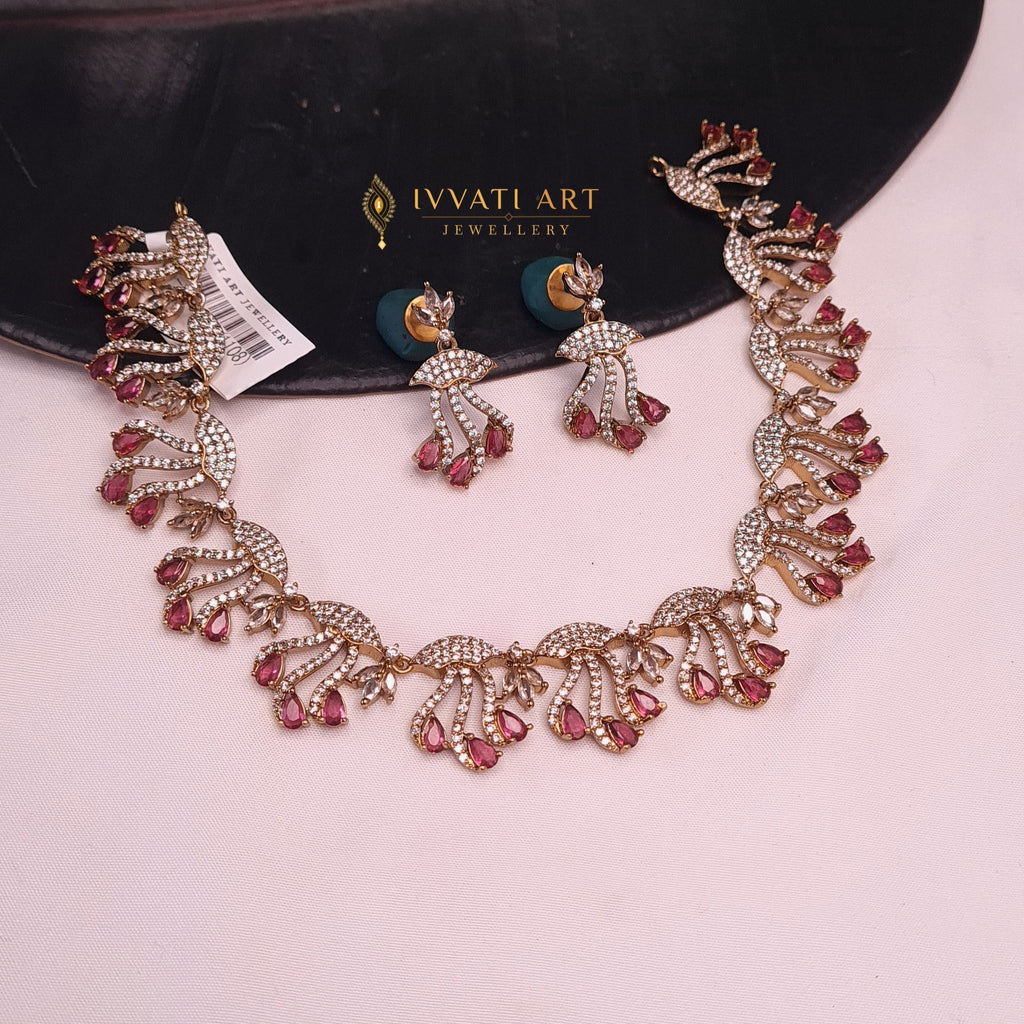Gold-plated CZ necklace set with ruby stones and matching earrings

