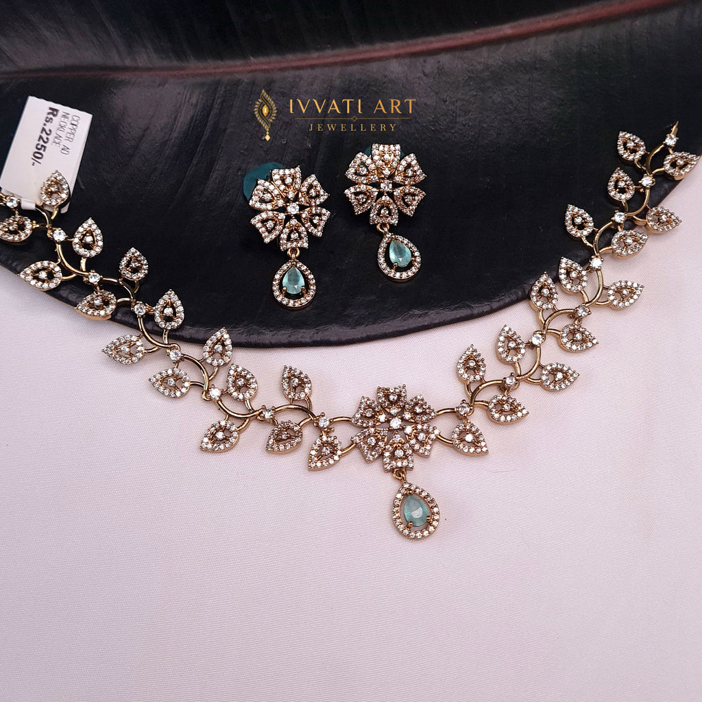 Leaf design necklace set with sea blue stones and matching earrings

