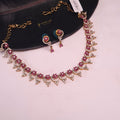 Flower shape CZ necklace set with ruby stones and earrings

