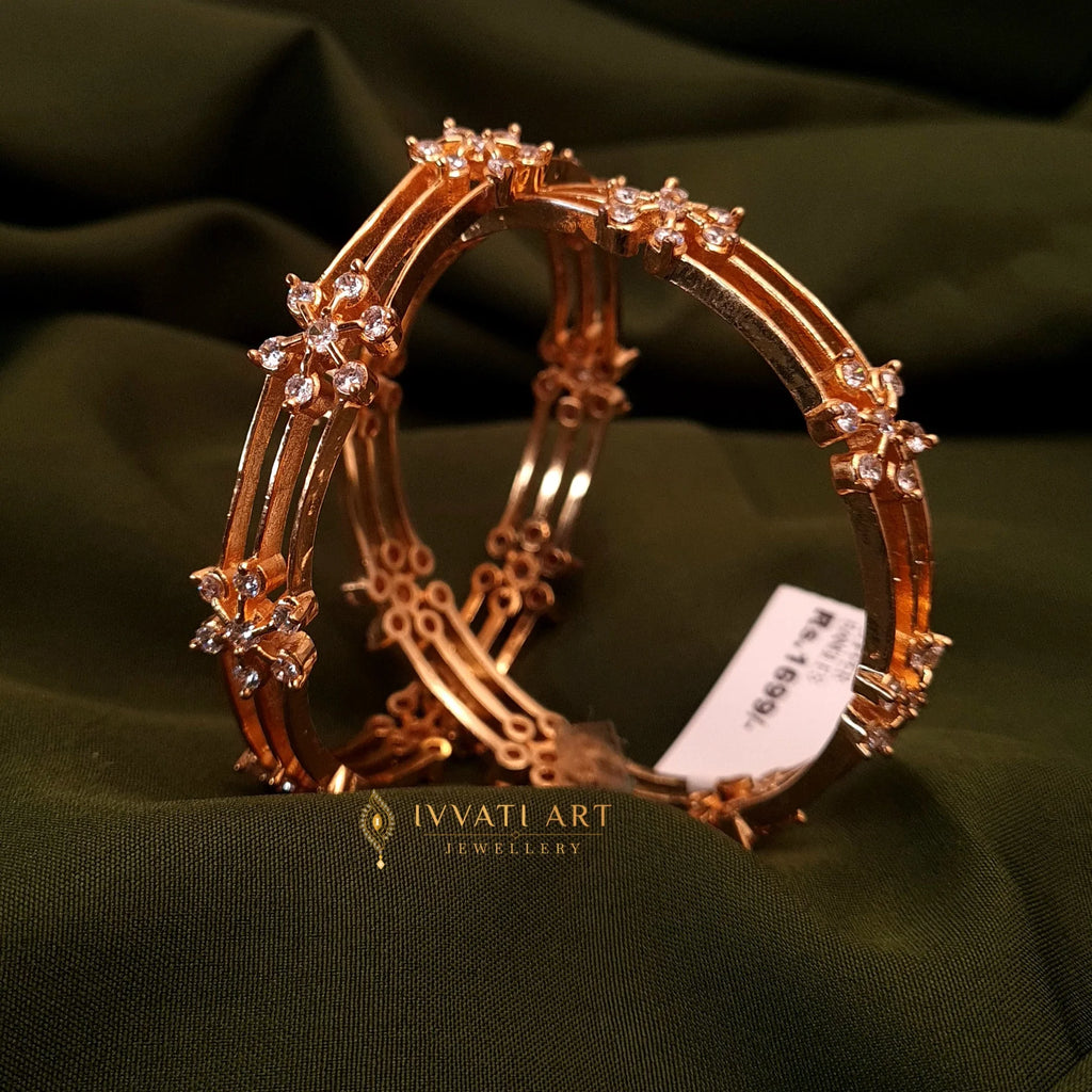 Gold finish bangles with zircon floral design by Ivvati Art Jewellery

