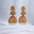 Gold plated copper jhumka earrings with traditional design

