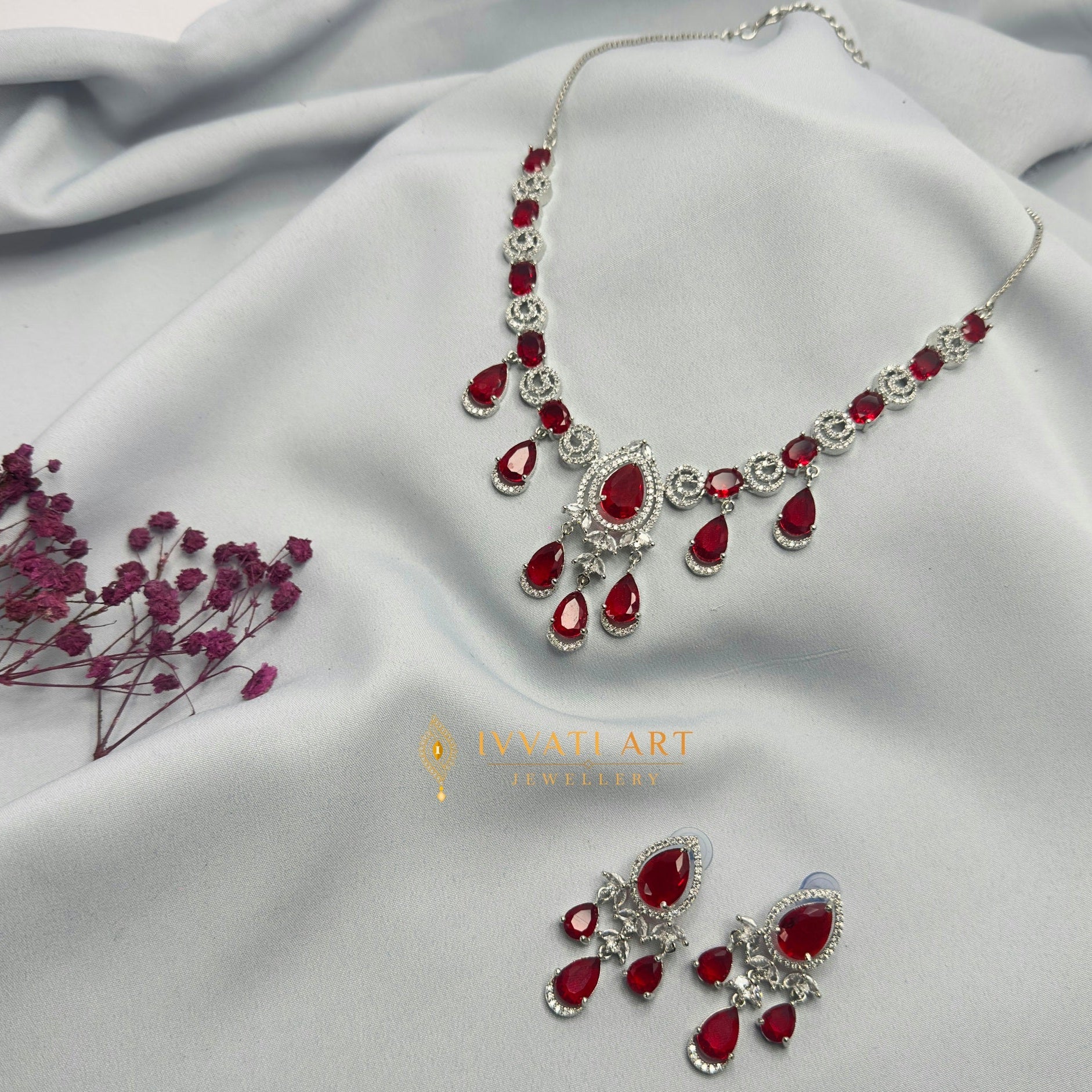 Crimson ruby silver diamond necklace set with matching earrings – handcrafted festive jewellery by Ivvati Art Jewellery.