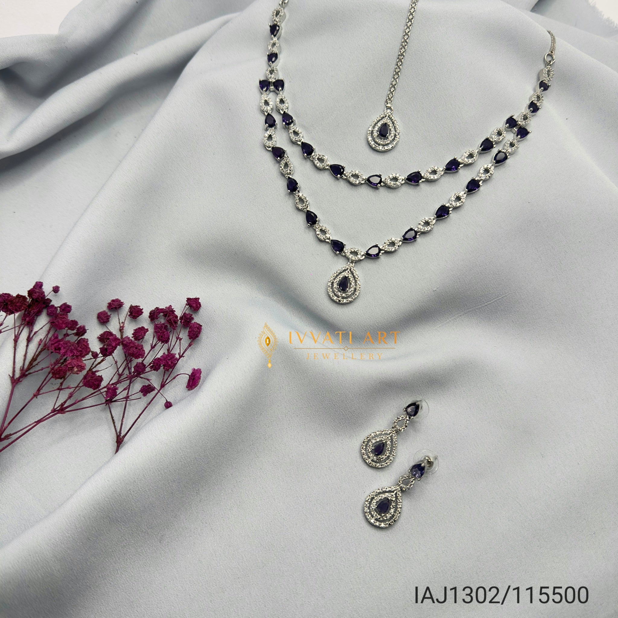 Sapphire blue double-layered silver diamond necklace set with matching earrings – handcrafted festive jewellery by Ivvati Art Jewellery.