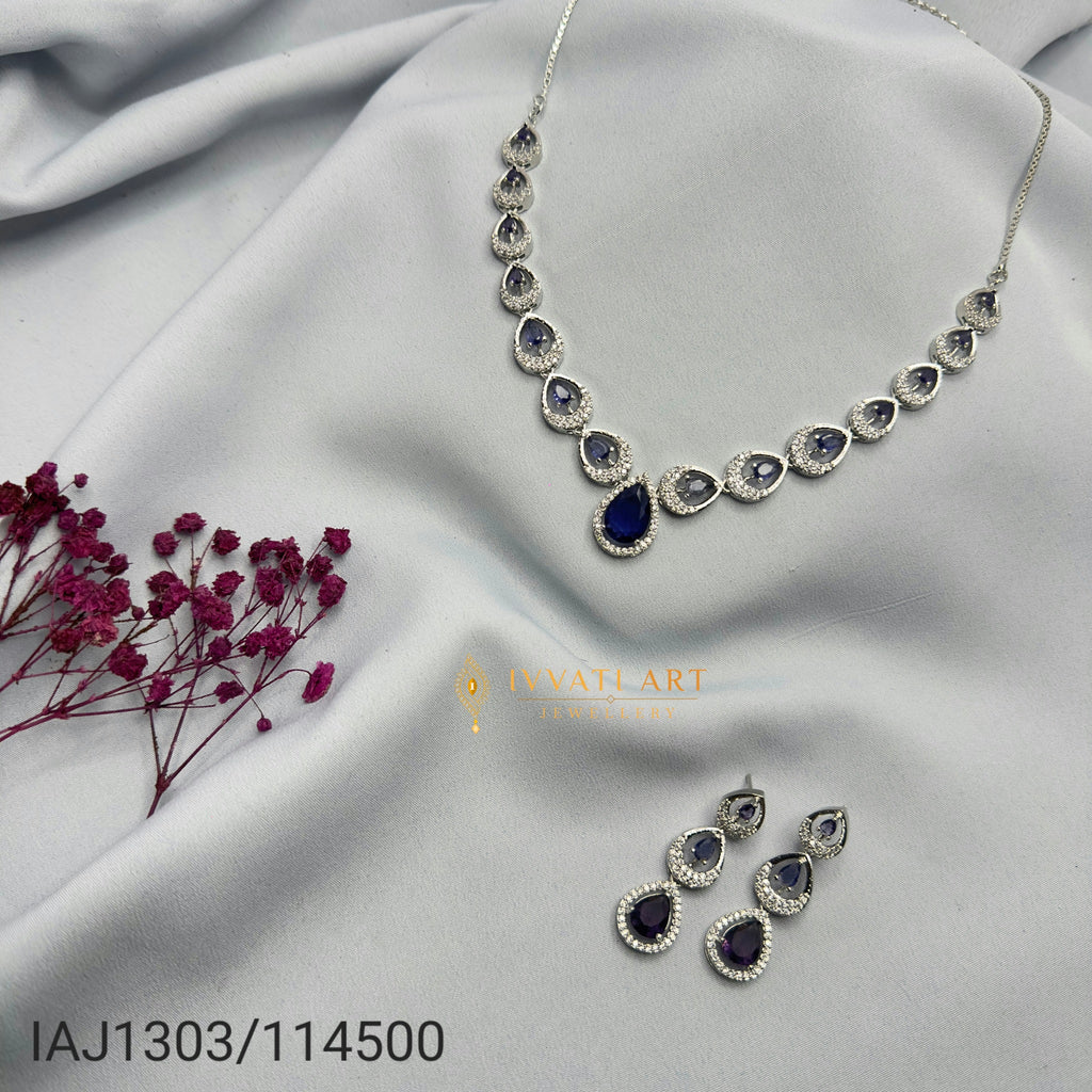 Blue sapphire teardrop silver diamond necklace set with matching earrings – handcrafted festive jewellery by Ivvati Art Jewellery.