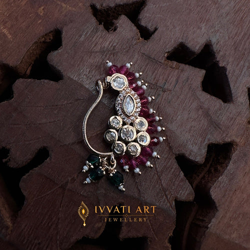 Antique gold Kundan nath with ruby cluster design, pearl detailing, and green crystal drops – handcrafted traditional jewellery by Ivvati Art Jewellery.
