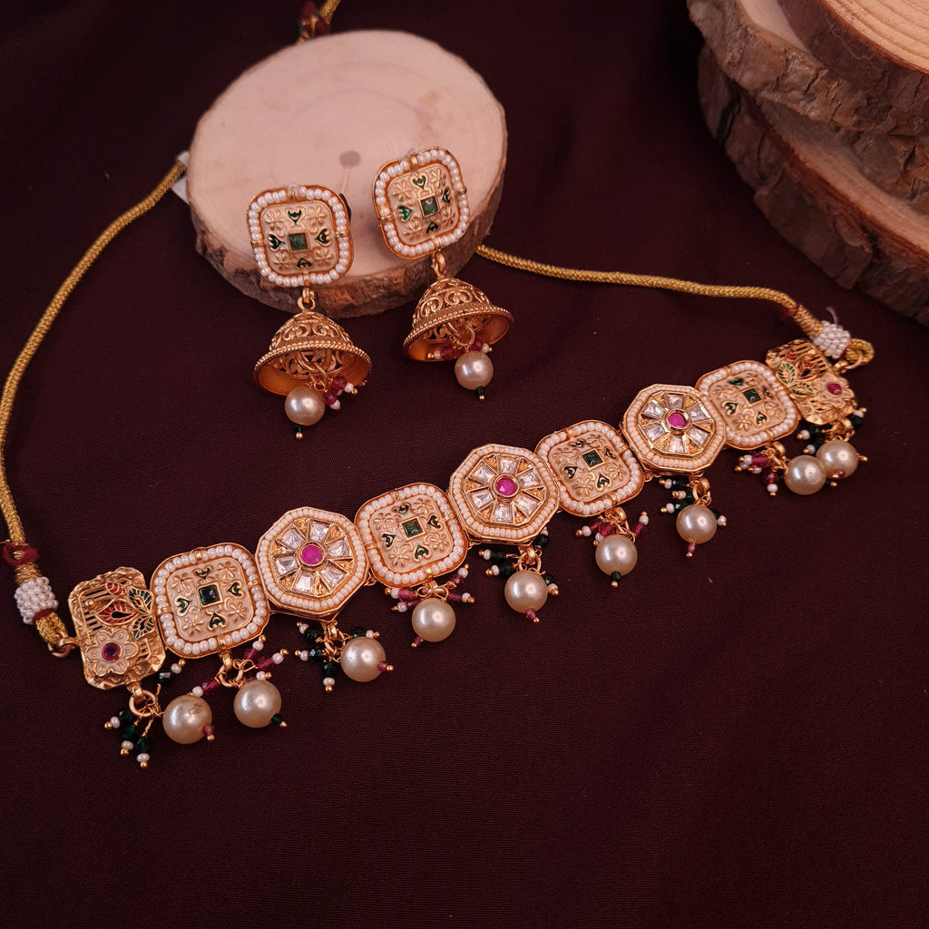 "Uncut Kundan Meena choker set with gold finish and meenakari enamel detailing"

