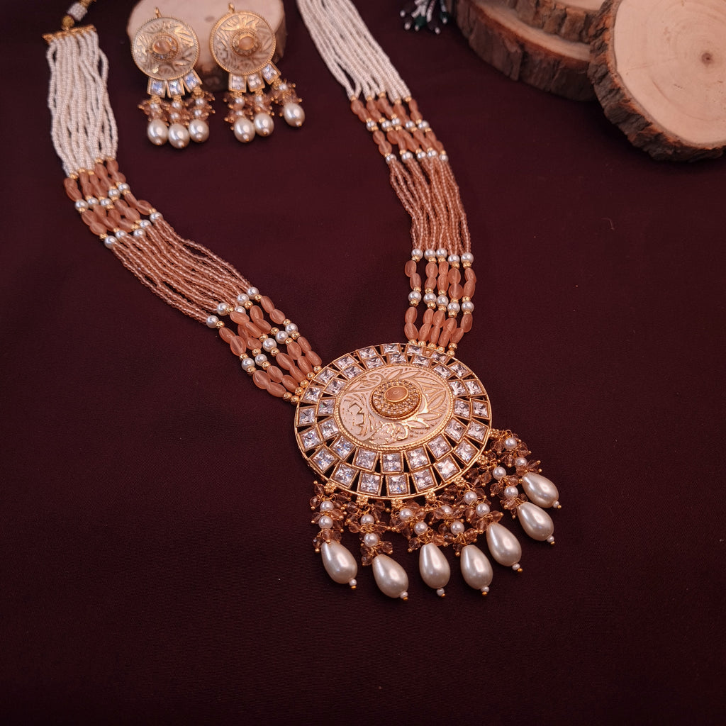 Gold-plated long CZ necklace set with peach stones and matching earrings

