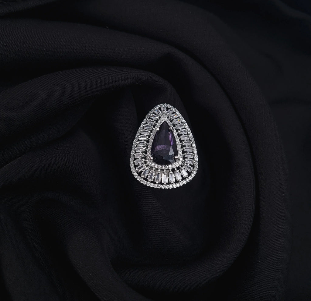 Silver AD ring with purple center stone and CZ accents

