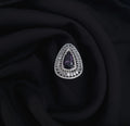 Silver AD ring with purple center stone and CZ accents

