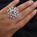 Silver AD ring with red center stone and CZ detailing

