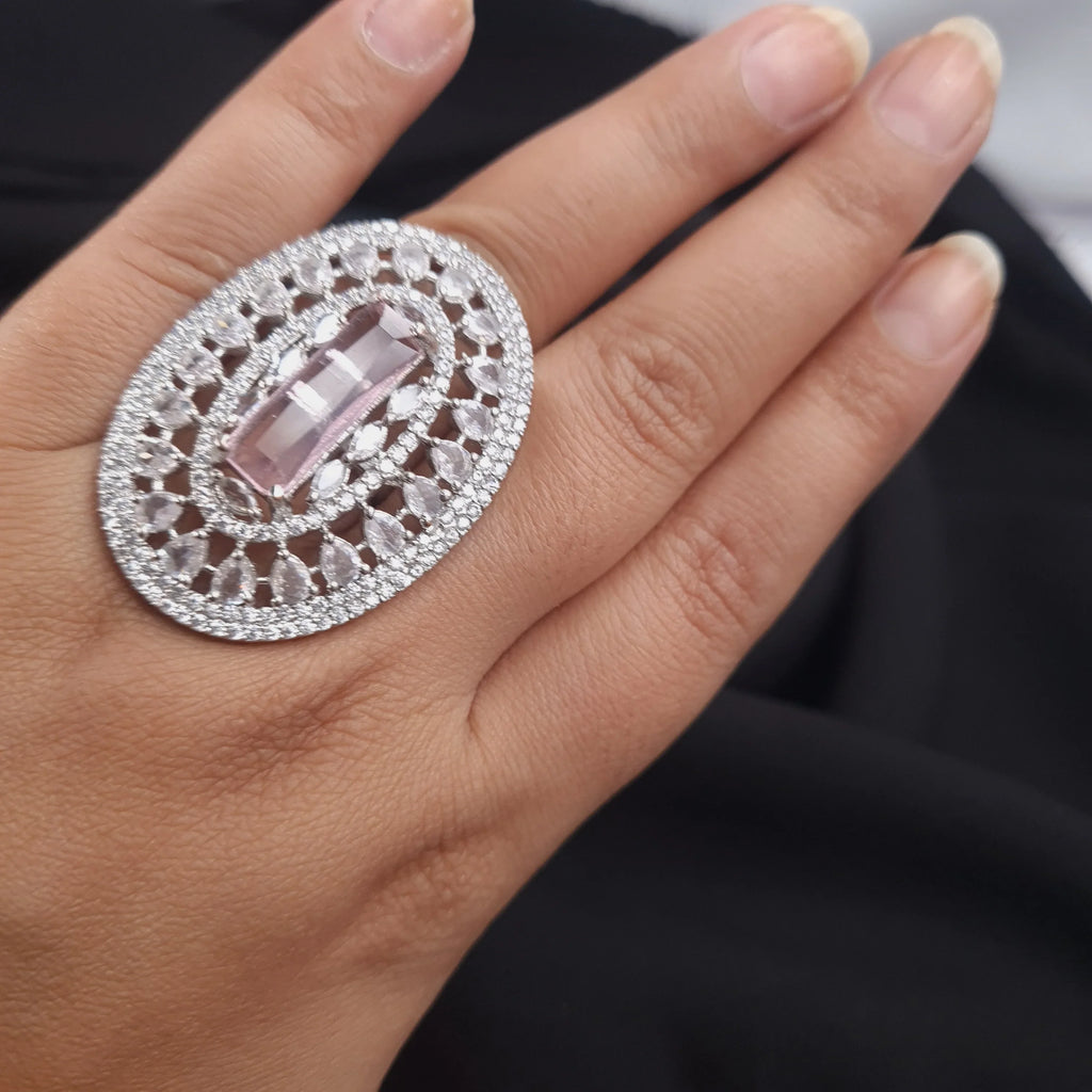 Silver AD ring with baby pink center stone and CZ detailing

