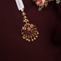 South Indian bridal tikka in copper with peacock motif and pearls
