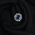 Silver CZ adjustable ring with blue center stone

