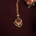 Traditional Indian bridal tikka with antique copper and pearl detailing
