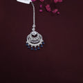 Maangtikka with American Diamonds and dangling blue stones on silk fabric