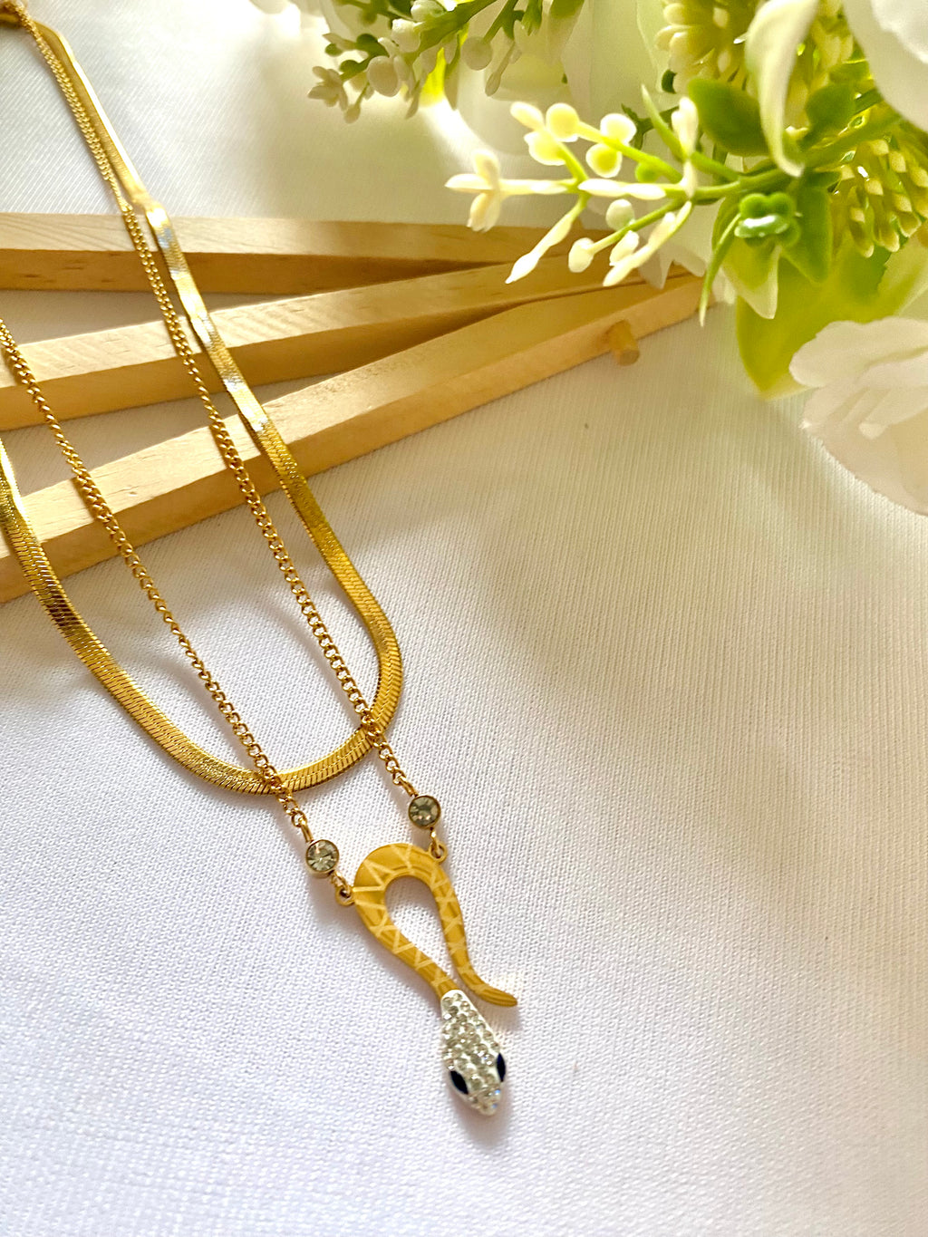 Dual-layer gold necklace with serpent pendant and CZ stones – 18K gold plated

