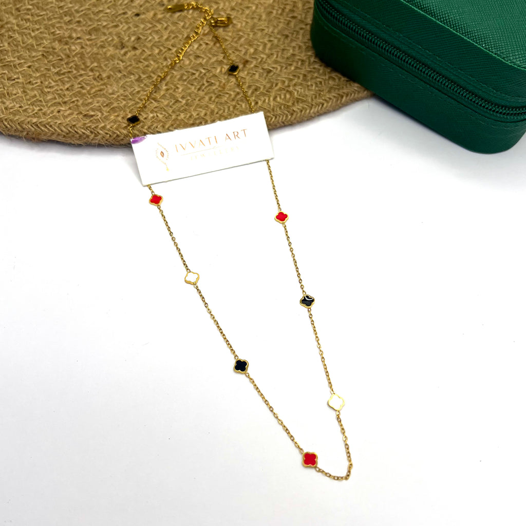 18K gold plated chain with multicolor clover enamel charms on a white background

