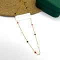 18K gold plated chain with multicolor clover enamel charms on a white background


