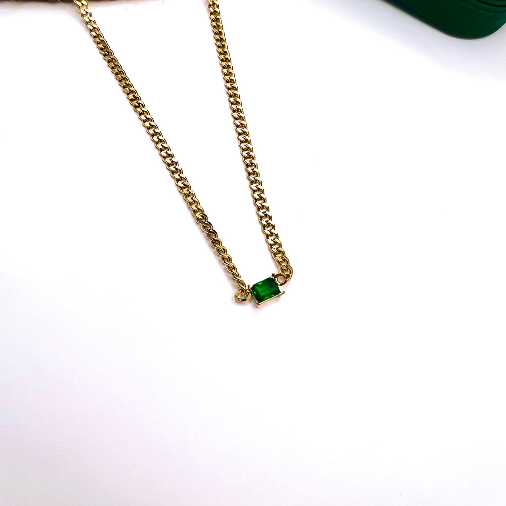 18K gold plated chunky curb chain with green emerald-cut stone pendant placed on a white background

