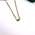 18K gold plated chunky curb chain with green emerald-cut stone pendant placed on a white background

