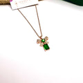 Rose gold emerald-cut green stone pendant with knot design on chain – Ivvati Art Jewellery

