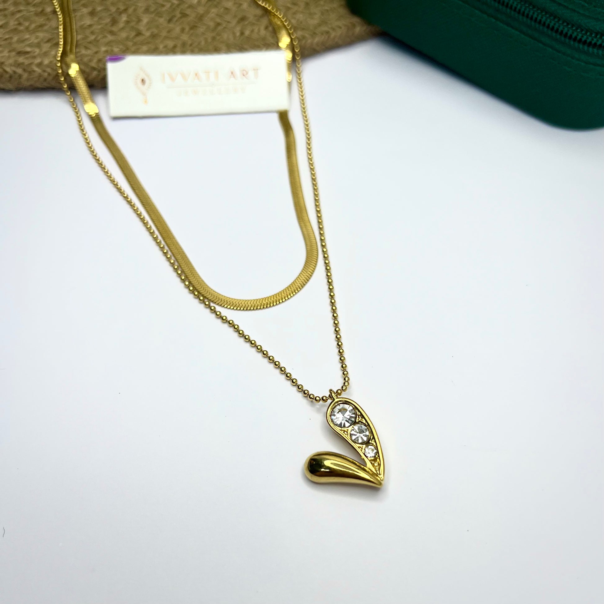 Two-layer gold necklace with asymmetrical heart pendant studded with CZ stones on one side – Ivvati Art Jewellery

