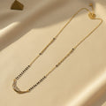American Diamond mangalsutra for women with black beads and curved CZ pendant | Ivvati Art Jewellery