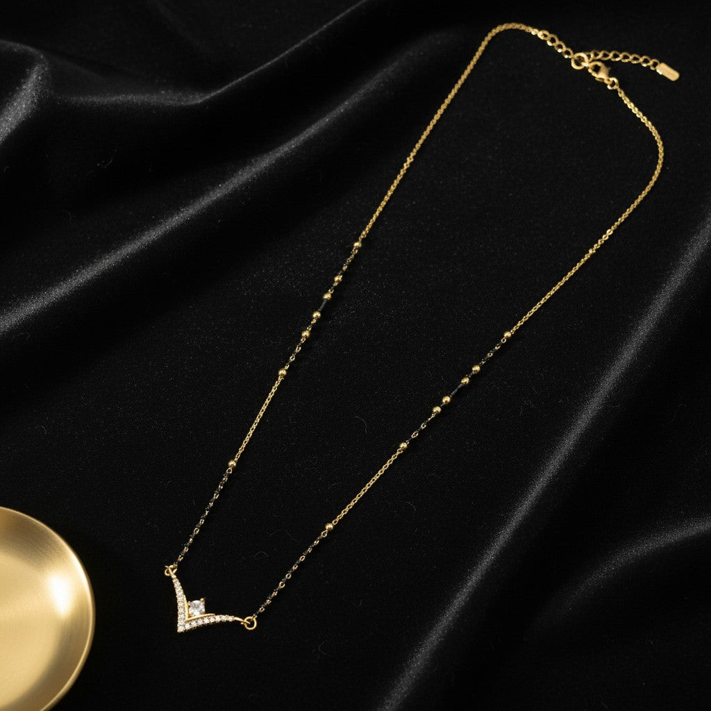 American Diamond mangalsutra for women with black beads and V shape CZ pendant | Ivvati Art Jewellery