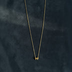 Delicate gold bow pendant necklace with fine chain for women