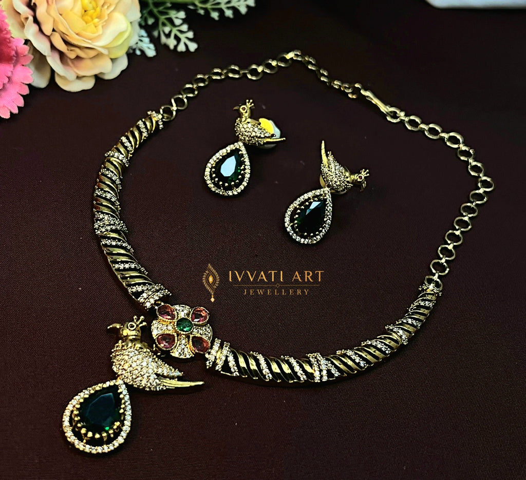 Emerald peacock design Indian necklace set with earrings in gold tone