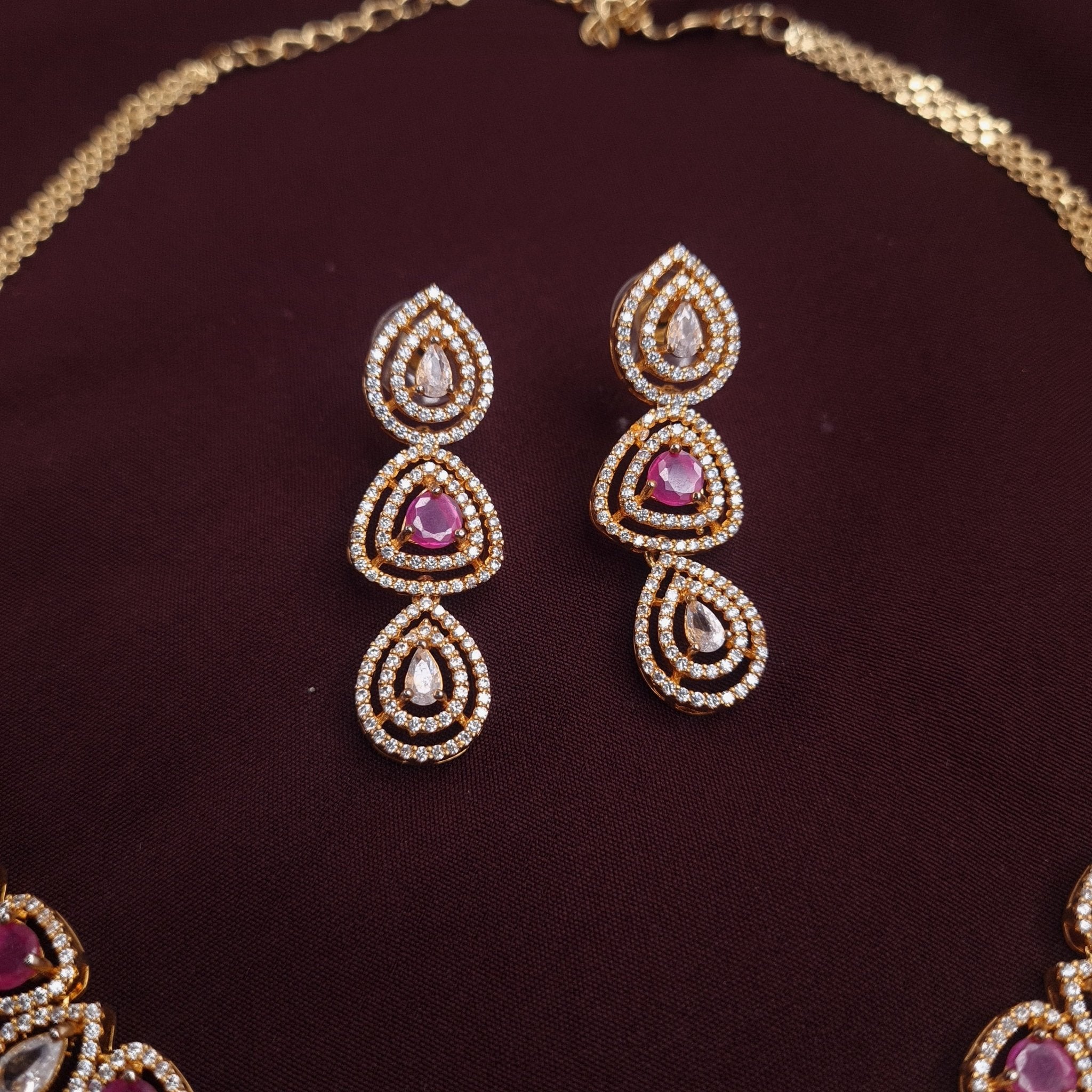 Gold Finish CZ Necklace Set with Ruby and Silver Stones jewellery - JEWELLERY SET | Ivvati Art Jewellery