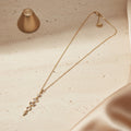 Gold floral cascade pendant necklace for women | Ivvati demi-fine jewellery