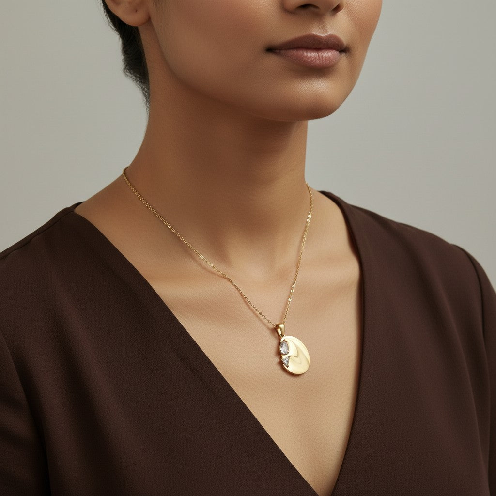 Gold moon pendant necklace for women with crescent moon design and crystal detailing