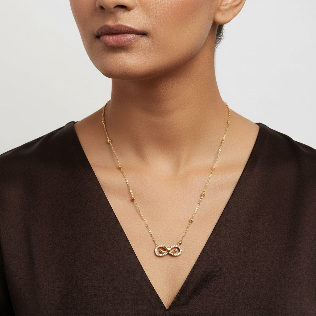Infinity pendant necklace for women with gold finish and crystal detailing