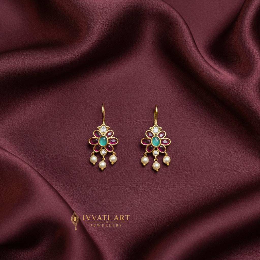 Ivvati pink and green Bugadi earrings with floral stones and pearl drops

5. JEWELLERY TYPE