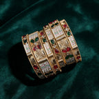 Ivvati Rajwadi Meenakari bangle set with red green stones and white detailing