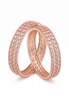 Close-up of Ivvati rose gold-tone AD CZ bangles with clear stone detailing