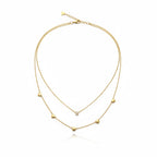 Minimal gold heart necklace with layered chains and heart accents for women | Ivvati Art Jewellery
