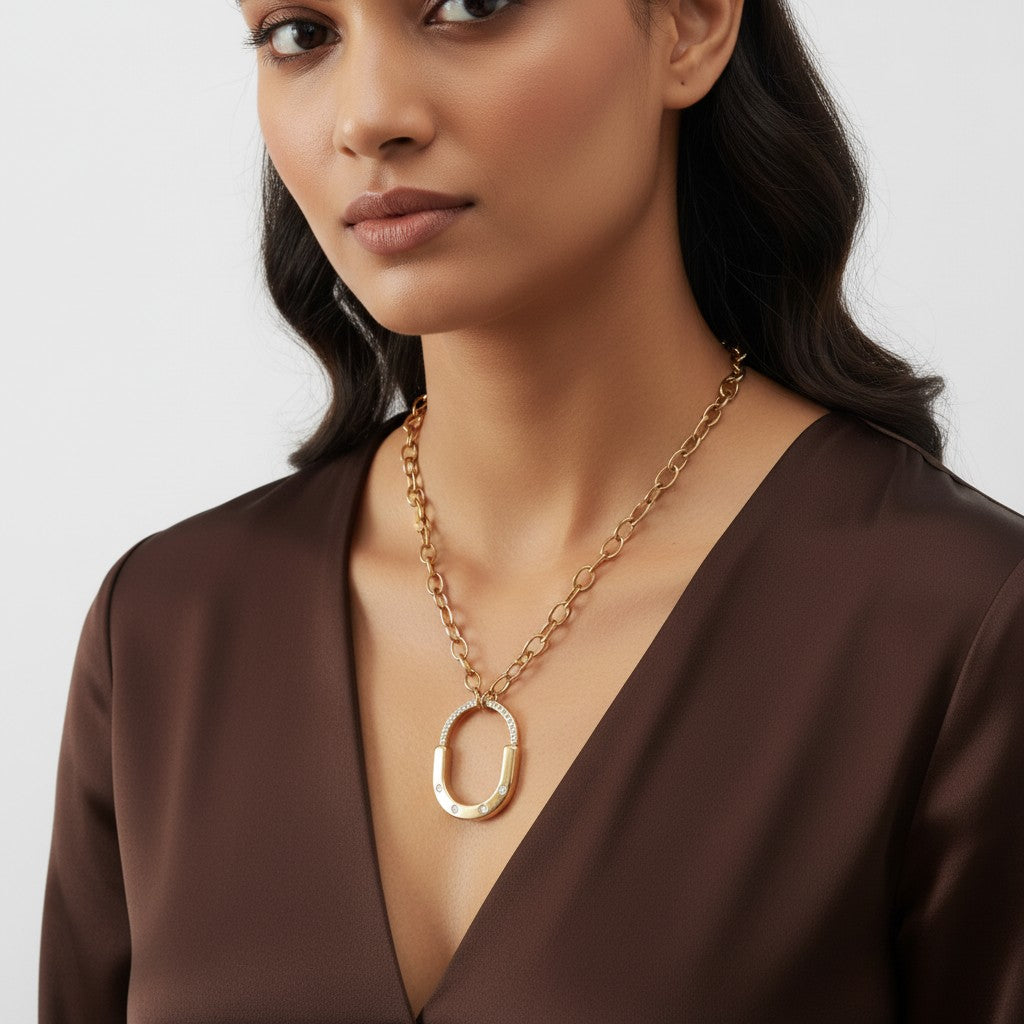 Gold oval statement necklace for women with chunky chain and crystal-style pendant