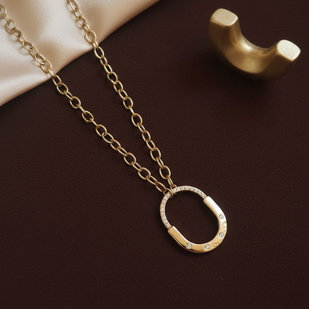 Gold oval pendant necklace for women with sparkling stone detailing | Ivvati demi-fine jewellery