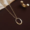 Gold oval pendant necklace for women with sparkling stone detailing | Ivvati demi-fine jewellery