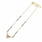 Simple modern daily wear mangalsutra with black beads and gold-tone American Diamond pendant | Ivvati Art Jewellery